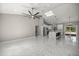 A spacious room with ample lighting, high ceilings, tile floors and an open floor plan at 14540 Se 33Rd Ter, Summerfield, FL 34491