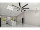 A bright living room that features a kitchen area with an island and marble floors at 14540 Se 33Rd Ter, Summerfield, FL 34491