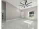 Open living area with tile floors and a large window at 14540 Se 33Rd Ter, Summerfield, FL 34491