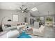 Well-designed living room featuring modern furnishings, and an open-concept layout at 14540 Se 33Rd Ter, Summerfield, FL 34491