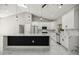 A bright living room that features a kitchen area with an island and marble floors at 14540 Se 33Rd Ter, Summerfield, FL 34491