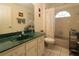 Functional bathroom with a green counter vanity, and a shower-tub combination at 15324 Sw 28Th Avenue Rd, Ocala, FL 34473