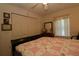 Bedroom with a double bed, closet, window, and light walls and carpet at 15324 Sw 28Th Avenue Rd, Ocala, FL 34473