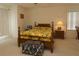 A cozy bedroom featuring a wooden bed frame and bright, patterned bedding at 15324 Sw 28Th Avenue Rd, Ocala, FL 34473