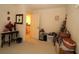 Cluttered room with beige carpet and door leading to hallway at 15324 Sw 28Th Avenue Rd, Ocala, FL 34473