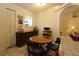 Cozy dining area featuring a round wood table with seating for four, and natural light at 15324 Sw 28Th Avenue Rd, Ocala, FL 34473
