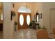 Entryway showcasing tiled flooring, double doors, and decorative accents that enhance the home's welcoming ambiance at 15324 Sw 28Th Avenue Rd, Ocala, FL 34473