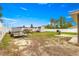 Large fenced backyard featuring a shed, trailer, boat, and grill at 16220 Sw 19Th Avenue Rd, Ocala, FL 34473