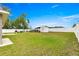 Spacious fenced backyard featuring a shed, boat, trailer, and a well-maintained lawn at 16220 Sw 19Th Avenue Rd, Ocala, FL 34473