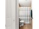 Neutral-toned bathroom with toilet, vanity, and tiled shower area at 16220 Sw 19Th Avenue Rd, Ocala, FL 34473