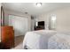 Neutral bedroom with a wardrobe, TV, and attached bathroom at 16220 Sw 19Th Avenue Rd, Ocala, FL 34473