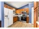 Updated kitchen with stainless steel appliances, white refrigerator, and tile backsplash at 16220 Sw 19Th Avenue Rd, Ocala, FL 34473