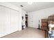 Open area with tile flooring, closet, a white door and a glimpse of a kitchen at 16220 Sw 19Th Avenue Rd, Ocala, FL 34473