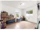 Bright room with tile flooring, natural light, and packed cardboard boxes at 16220 Sw 19Th Avenue Rd, Ocala, FL 34473