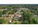 Sprawling aerial shot showcasing a home and the adjacent properties, highlighted by the verdant landscape and established trees at 2032 Se 12Th St, Ocala, FL 34471