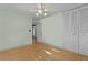 Bedroom with hardwood floors, ample closet space, and access to the bathroom at 2032 Se 12Th St, Ocala, FL 34471