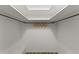 Walk-in closet with white walls, ceiling light and a clothing rack at 2032 Se 12Th St, Ocala, FL 34471