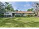 Charming single-story home with a well-maintained lawn and manicured bushes beneath the windows at 2032 Se 12Th St, Ocala, FL 34471