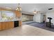 Bright eat-in kitchen with tile floors, wooden cabinets, and dark appliances at 2032 Se 12Th St, Ocala, FL 34471