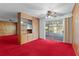 Spacious living room with large sliding doors leading to a sunroom at 2032 Se 12Th St, Ocala, FL 34471
