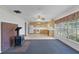 View of the living room with a decorative wood burning stove, connecting to the adjacent kitchen at 2032 Se 12Th St, Ocala, FL 34471