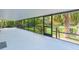 Screened-in patio providing an ideal space for relaxing and enjoying the scenic backyard at 2032 Se 12Th St, Ocala, FL 34471