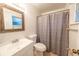Bathroom featuring a vanity with a mirror, toilet, and a shower with a curtain at 2140 Ne 40Th St, Ocala, FL 34479