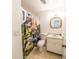 Bathroom featuring dinosaur themed shower curtain, toilet, sink with mirror and tile flooring at 2140 Ne 40Th St, Ocala, FL 34479