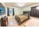 Cozy bedroom with tile flooring, a queen bed, and natural light from the window at 2140 Ne 40Th St, Ocala, FL 34479