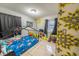 bedroom with a Paw Patrol theme, featuring a metal-framed bed and playful decor at 2140 Ne 40Th St, Ocala, FL 34479