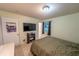 Comfortable bedroom featuring tile flooring, neutral walls, and a modern bed frame at 2140 Ne 40Th St, Ocala, FL 34479