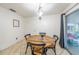 Bright dining area featuring a wooden table set near the sliding door with backyard view at 2140 Ne 40Th St, Ocala, FL 34479