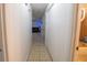 Hallway with tiled flooring leading to the living room and bathroom at 2140 Ne 40Th St, Ocala, FL 34479
