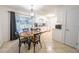 Bright kitchen area with a dining table, sliding doors, and white cabinetry at 2140 Ne 40Th St, Ocala, FL 34479