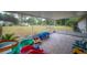 This enclosed patio offers a view of the backyard and space to play at 2140 Ne 40Th St, Ocala, FL 34479
