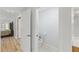 Powder room adjacent to bedroom with wood floors at 22189 Sw Neptune Blvd, Dunnellon, FL 34431