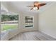Bedroom with a beautiful large window offering tons of natural light and nice flooring at 22189 Sw Neptune Blvd, Dunnellon, FL 34431