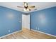 A cozy bedroom featuring a ceiling fan and neutral walls, offering a comfortable and inviting space at 22189 Sw Neptune Blvd, Dunnellon, FL 34431