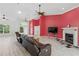 Bright living room boasts hardwood floors, fireplace, and a ceiling fan, perfect for relaxation at 22189 Sw Neptune Blvd, Dunnellon, FL 34431