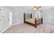 A well-lit main bedroom with hardwood floors, decorative walls, and patio doors at 22189 Sw Neptune Blvd, Dunnellon, FL 34431
