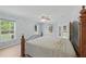 Spacious main bedroom with natural light, wood-look floors, and decorative walls at 22189 Sw Neptune Blvd, Dunnellon, FL 34431