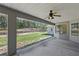 View of the covered patio featuring a ceiling fan and overlooking the backyard at 22189 Sw Neptune Blvd, Dunnellon, FL 34431
