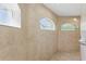 Modern shower with horizontal windows allowing natural light to shine through at 22189 Sw Neptune Blvd, Dunnellon, FL 34431