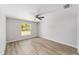 Light-filled bedroom with ceiling fan and view of the backyard at 25 Juniper Pass Way, Ocala, FL 34480