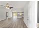 Bright, open-concept living space showcasing sleek floors and a seamless flow into the modern kitchen at 25 Juniper Pass Way, Ocala, FL 34480