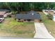 Aerial view of a well-maintained home, showcasing the neat landscaping and spacious driveway at 2576 Ne 34Th St, Ocala, FL 34479