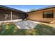Backyard featuring a concrete patio, screened-in porch, and green lawn at 2576 Ne 34Th St, Ocala, FL 34479