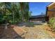 View of the backyard showcasing mature landscaping, a bird bath, and privacy at 2576 Ne 34Th St, Ocala, FL 34479