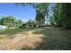 Expansive backyard featuring a lush lawn, mature trees, and partial fencing at 2576 Ne 34Th St, Ocala, FL 34479