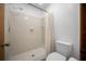 Bright bathroom featuring a walk-in shower with white tiling and a modern elongated toilet at 2576 Ne 34Th St, Ocala, FL 34479